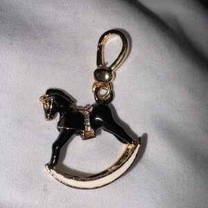 Black and gold Juicy Couture charm